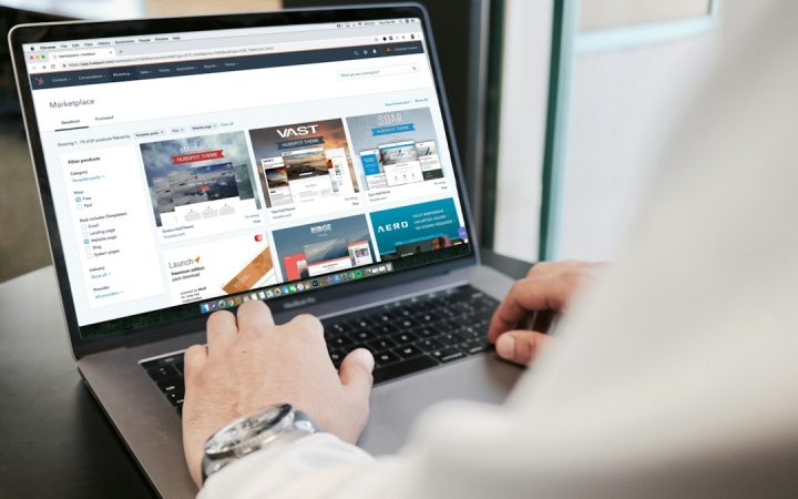 Person working on a laptop building a business website