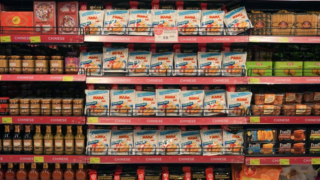 Grocery store aisle with packaged food products on shelves